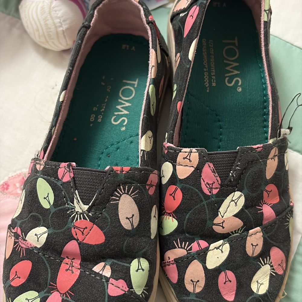 TOMS Black Slip-Ons with Christmas lights